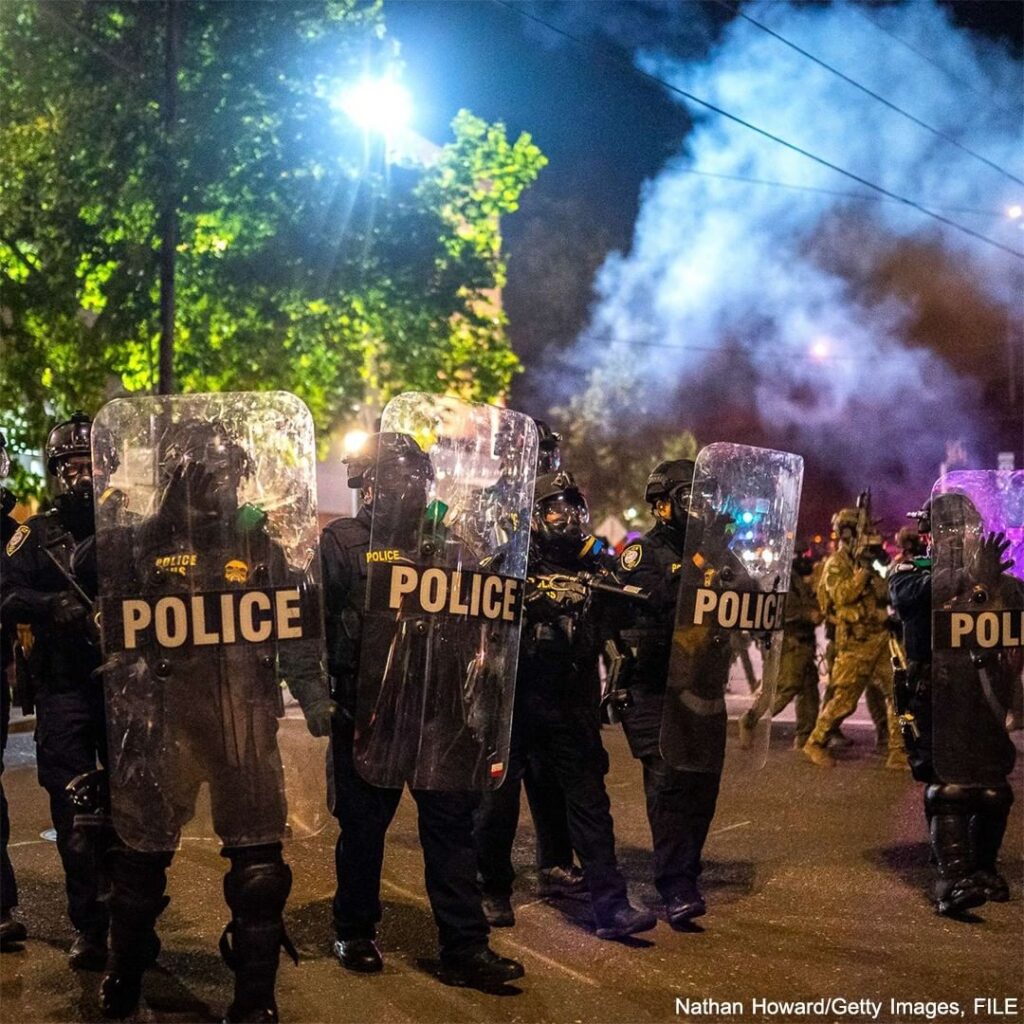 Portland, Oregon, and Oakland, California, sued the Department of Justice and De...