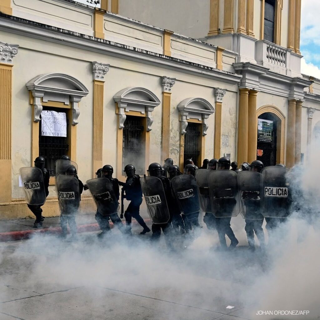 Riot policemen take position during a protest demanding the resignation of Presi...
